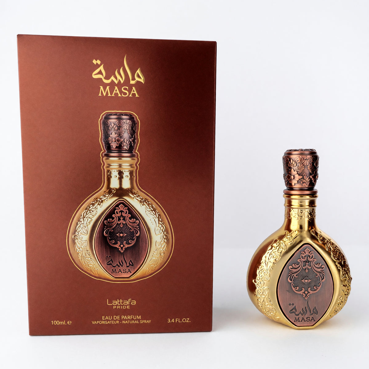 Ornate gold glass eau de parfum spray bottle with decorative cap and label