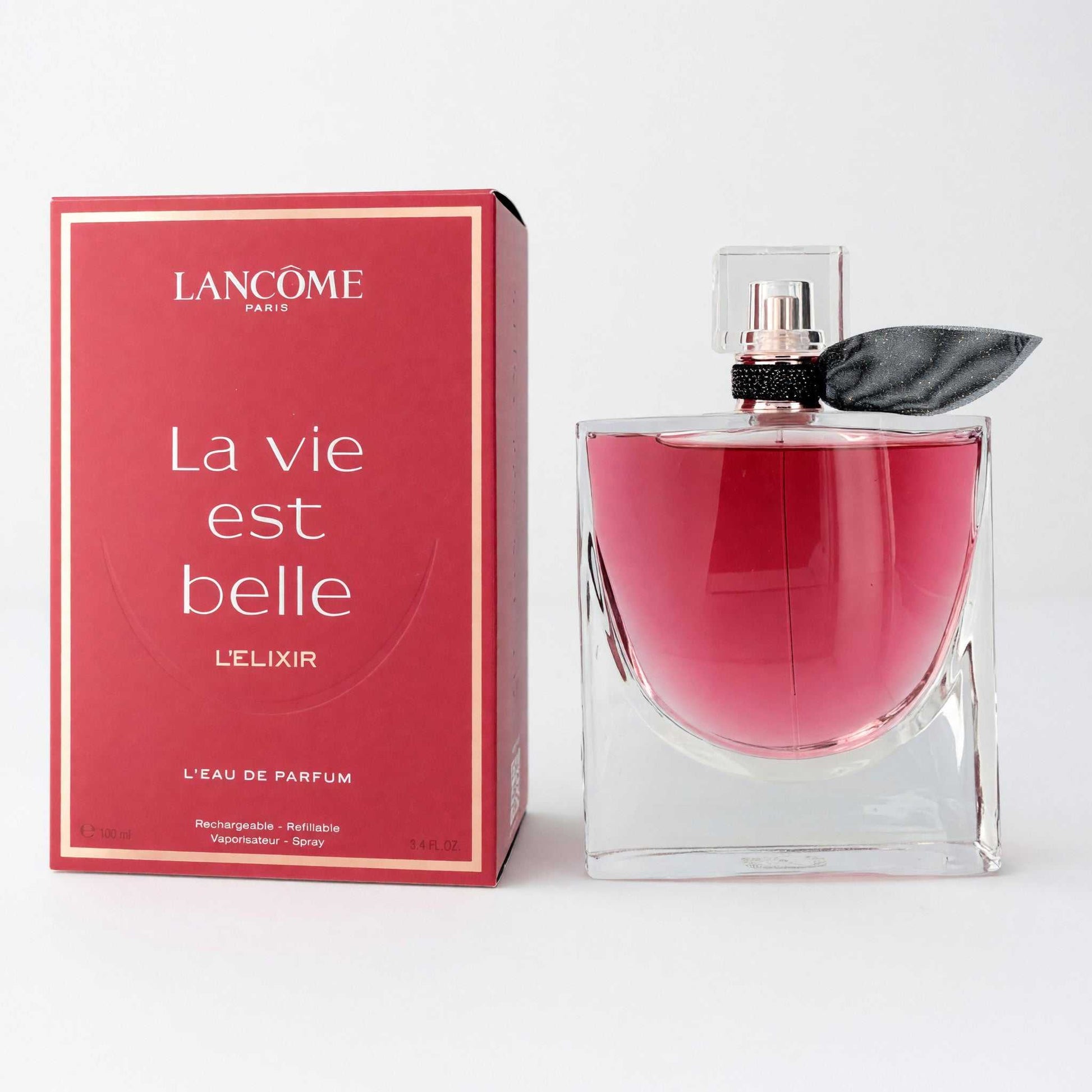 Lancome l'Elixir eau de parfum bottle, pink glass with black cap; boxed set