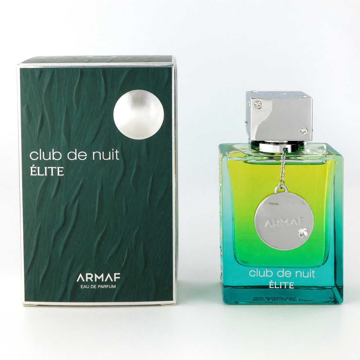 Club De Nuit Elite Eau de Parfum spray bottle with silver cap and round pendant beside its box