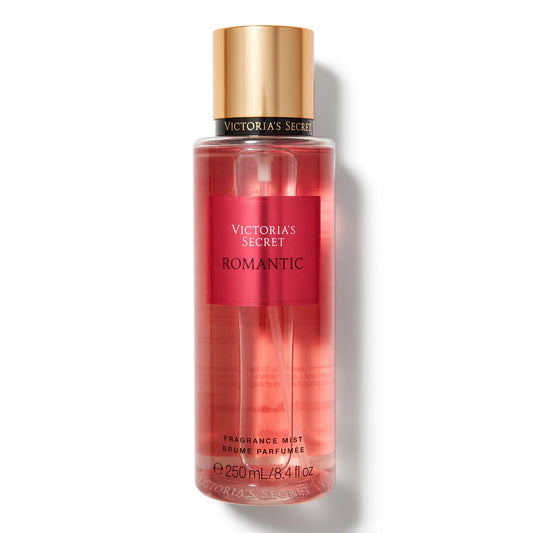 Victoria's Secret Romantic fragrance mist bottle with gold cap, red-pink spray