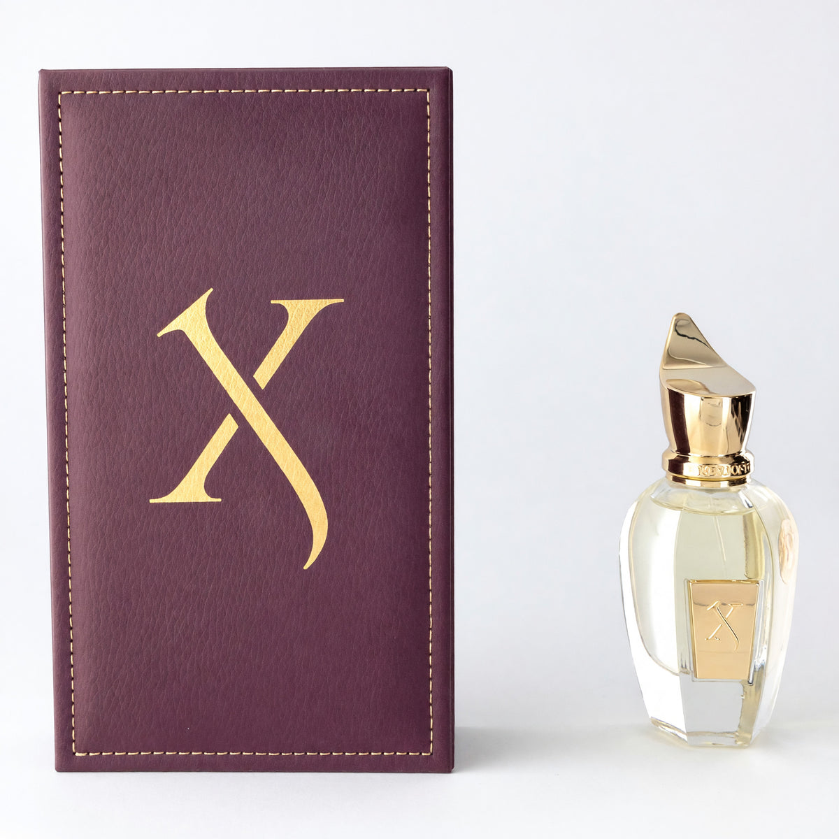Nio by Xerjoff EDP spray with gold-capped bottle and purple leather-look box