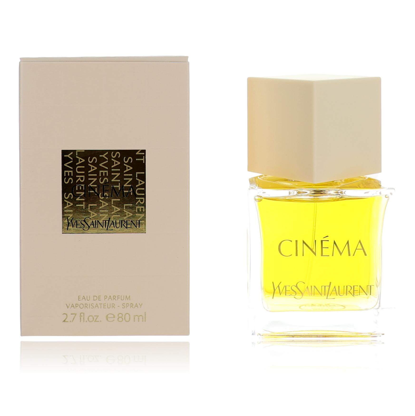 Women’s perfume spray bottle with yellow liquid and CINÉMA box by Yves Saint Laurent