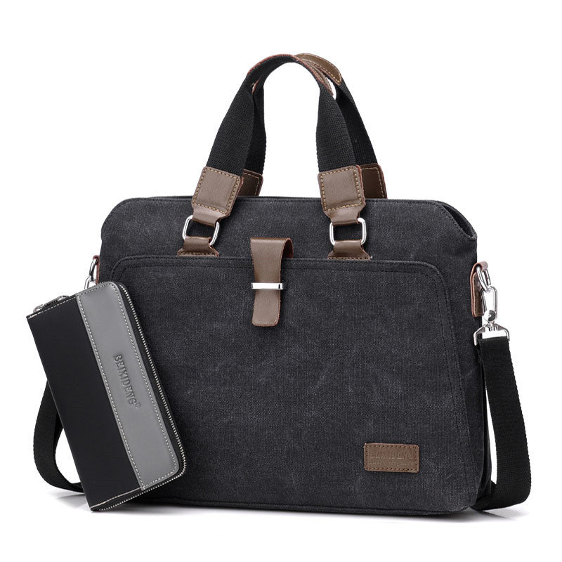 Canvas briefcase in black with zip pocket wallet on left, dual handles, and front clasp