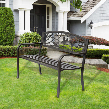 Brown cast iron garden bench with curved armrests and bird backrest
