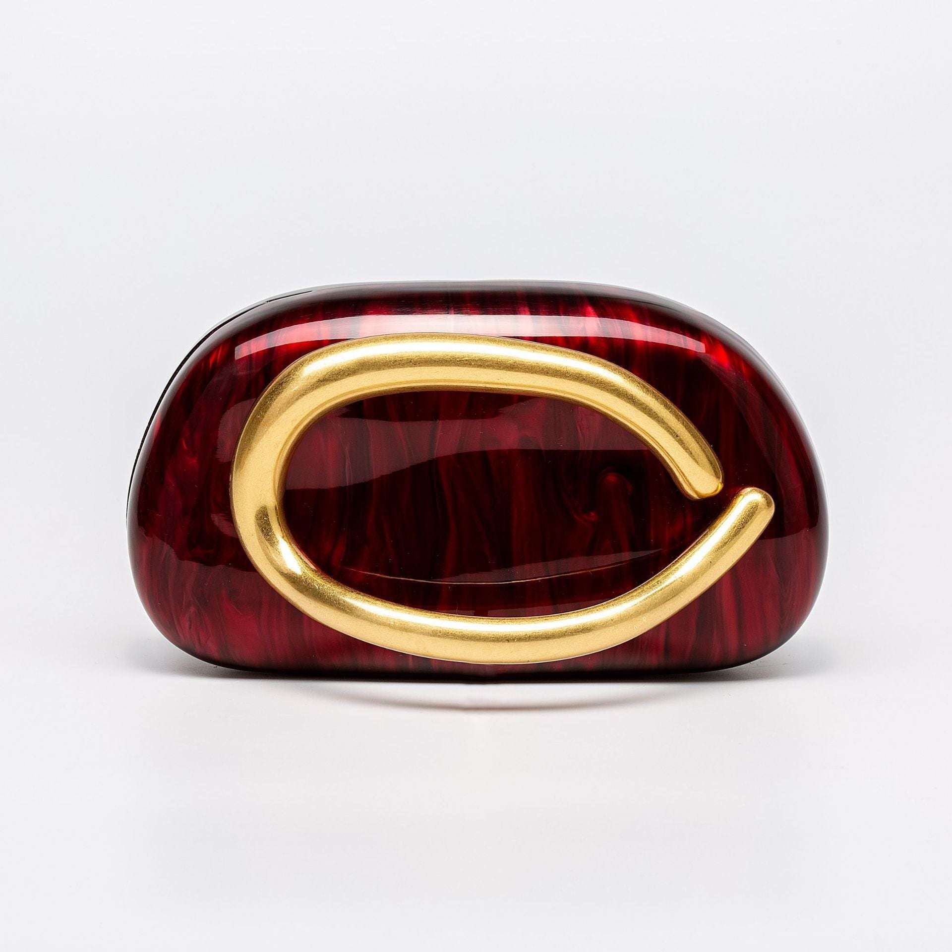 Burgundy acrylic dinner clutch with oval gold clasp and short handle strap