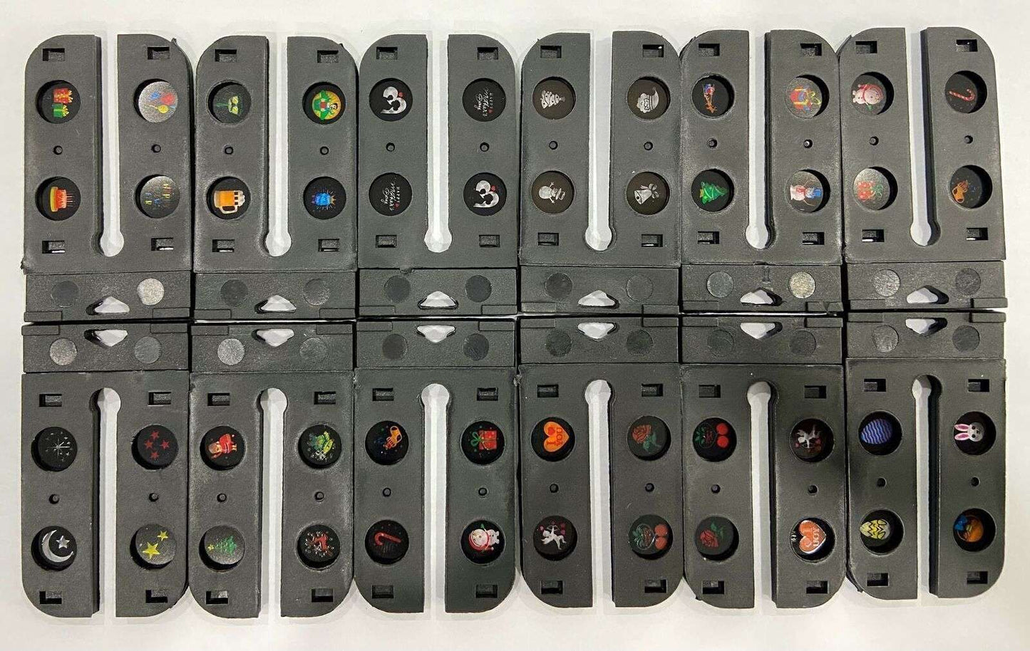 Set of gray rectangular components with colored circular inserts on a white background