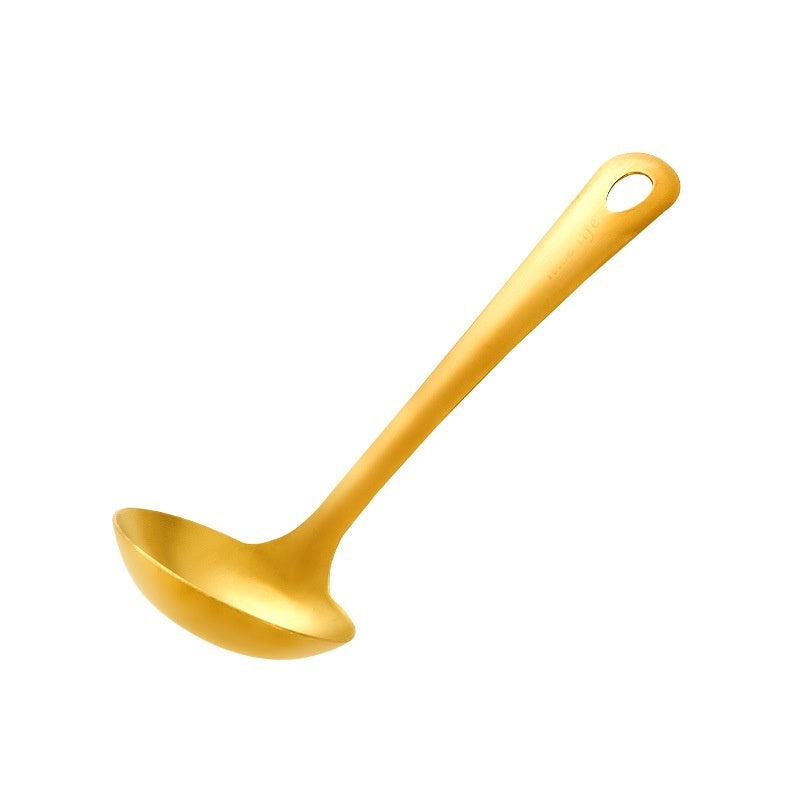 Gold ladle on a white background