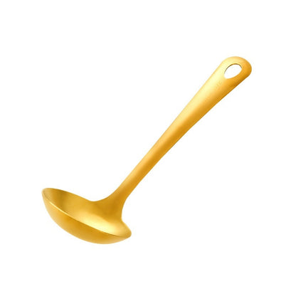 Gold ladle on a white background