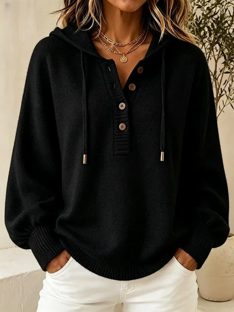 Black hooded knit sweater with button placket, drawstring cords, and ribbed cuffs