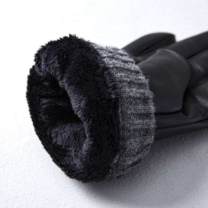 Black gloves with textured cuff on a white background