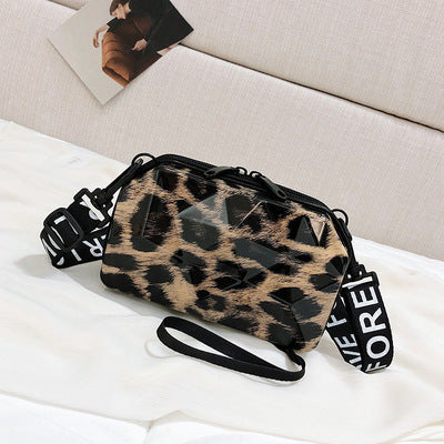 Leopard print mini cosmetic bag with black zipper and crossbody strap