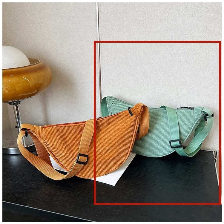 Orange large dumpling crossbody bag with mint shoulder strap