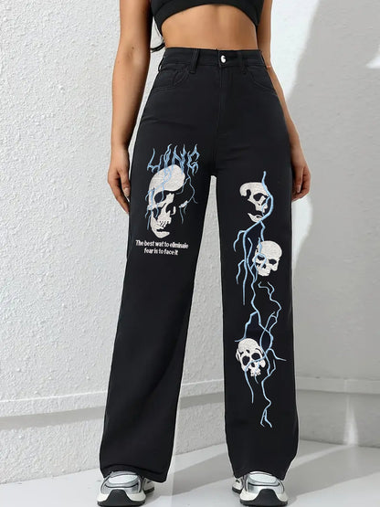 Black women’s jeans with skull and flame embroidery on front wide-leg panels