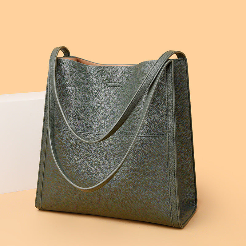 Large commuter tote bag in green pebbled faux leather with long shoulder strap