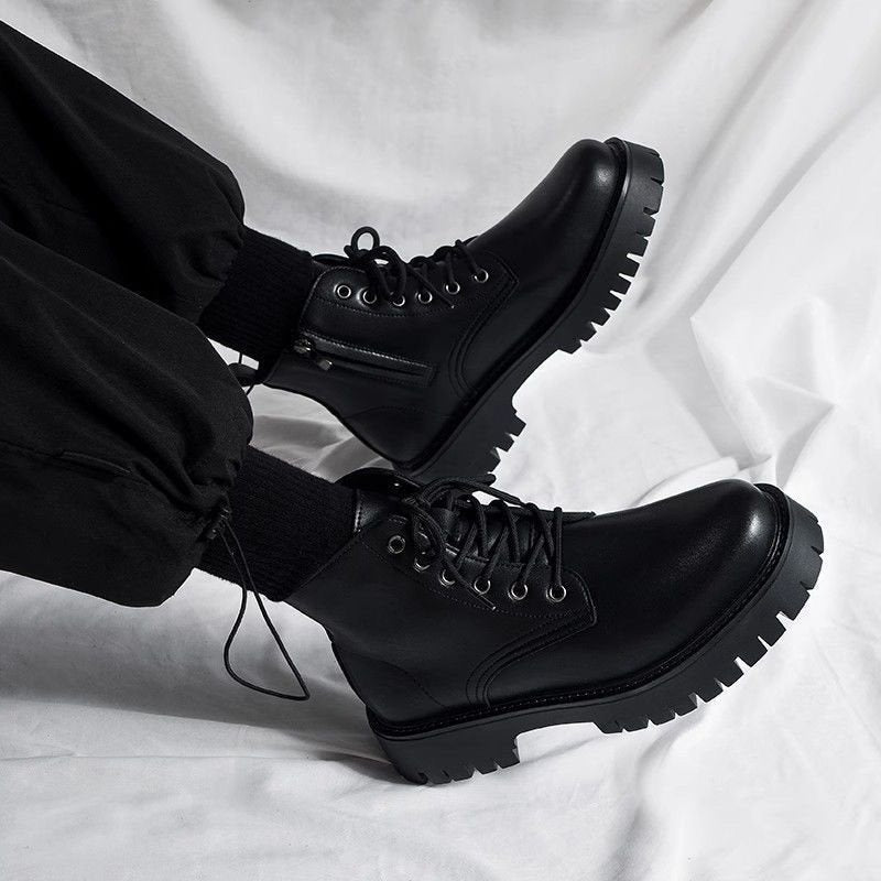 Black high-top lace-up boots with chunky lug soles, angled side view