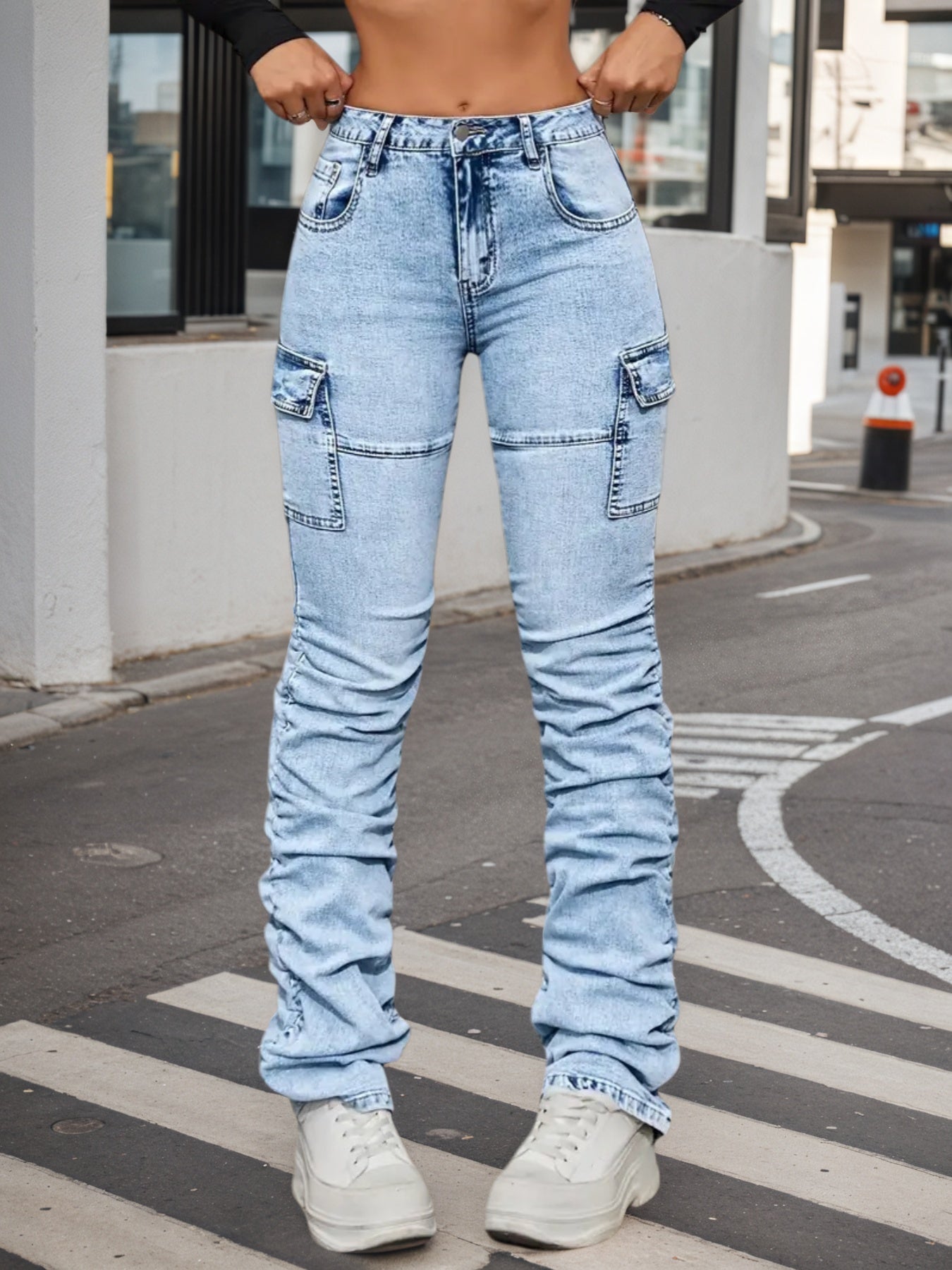 Women’s high-waisted light blue jeans with multiple cargo patch pockets