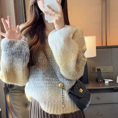 Person wearing a textured sweater with a blurred background