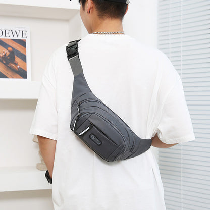 Gray crossbody waist bag with zippered front pouch on adjustable strap