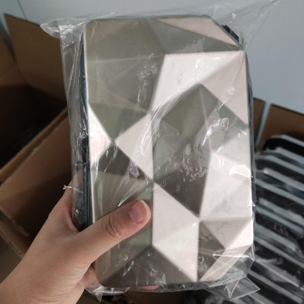 Plastic-wrapped geometric cosmetic bag, white, with zip and carry strap