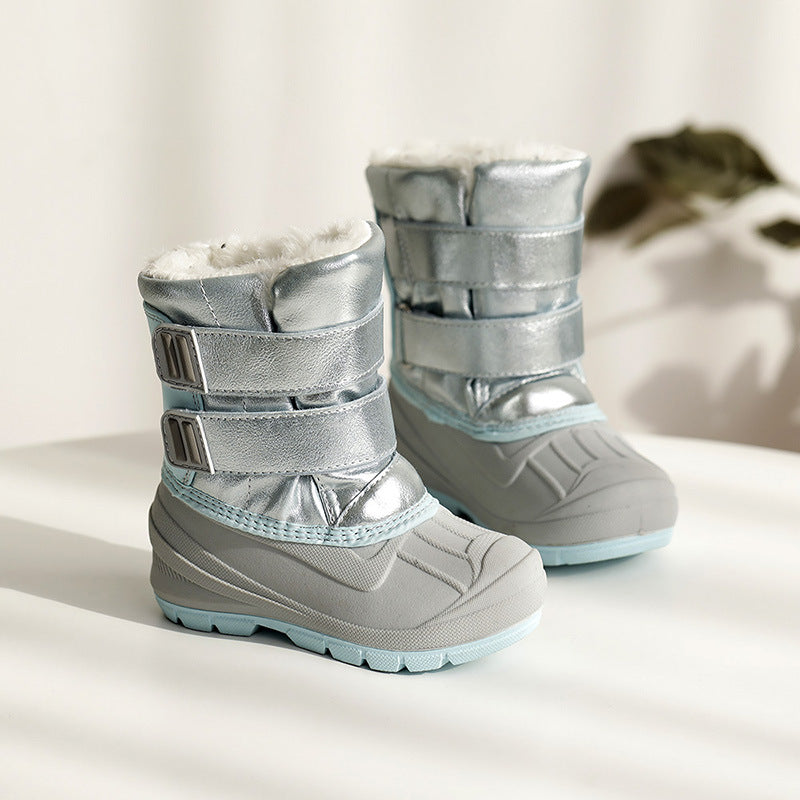 Kids winter snow boots in metallic silver with white fur cuff and strap closures