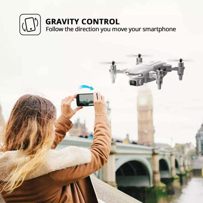 Person using a smartphone with a drone in the foreground, set against a cityscape.