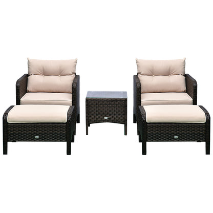 Two wicker lounge chairs with beige cushions and a center ottoman, dark frame