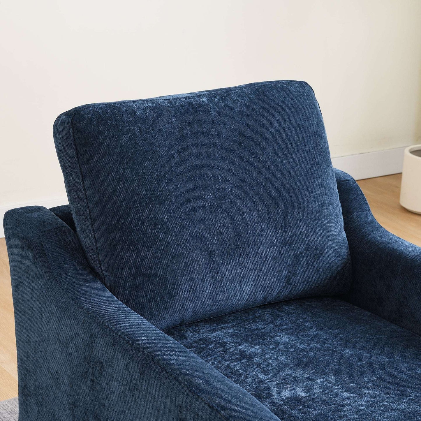 Navy blue upholstered accent chair with high back and wide cushioned seat