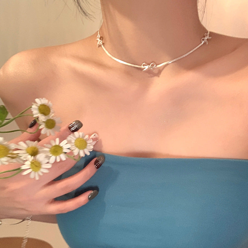 Butterfly charm choker-style necklace with sparkling butterfly pendant