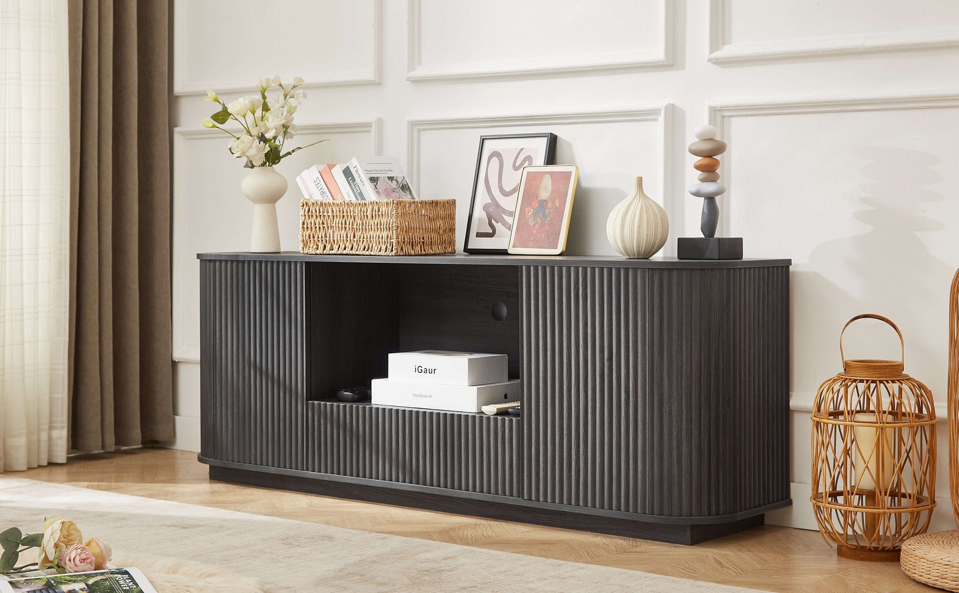 Black rounded sideboard with vertical ribbed panels and center open storage compartment