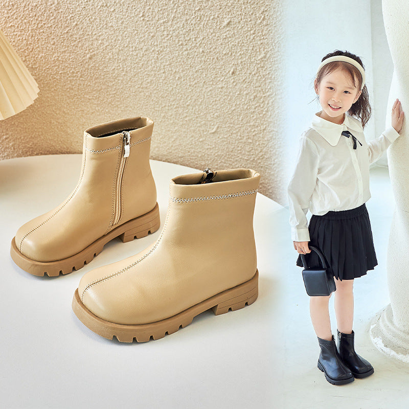 Kids' soft-soled Martin boots in tan with side zipper and rugged tread sole.