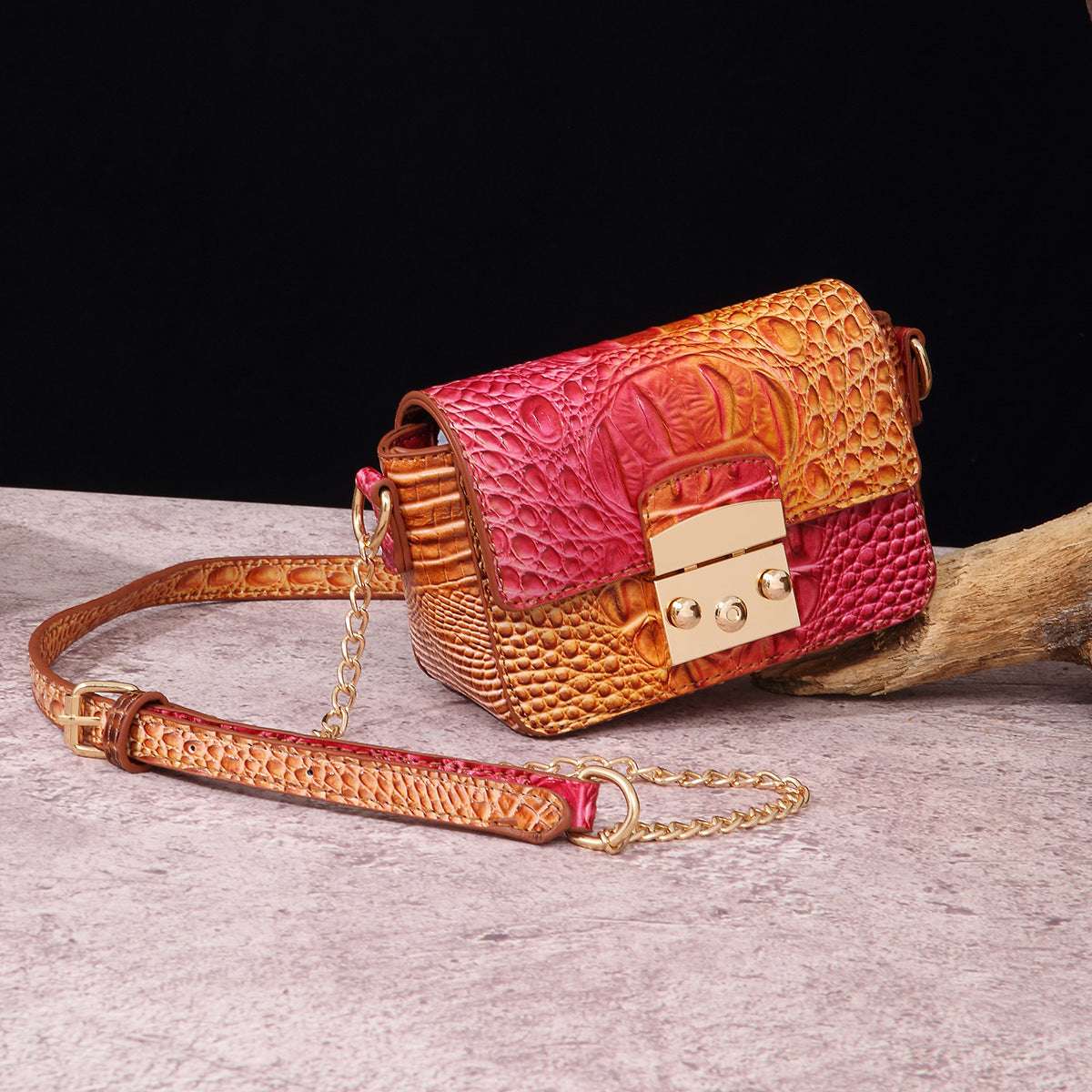 Pink-and-brown one-shoulder crossbody bag with crocodile texture, gold-tone clasp, chain strap.