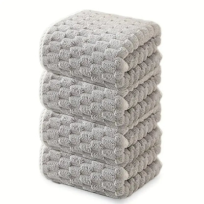 Waffle bath towel set, multiple folded gray towels stacked with waffle pattern