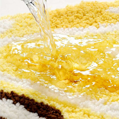 Lemon bath mat with yellow-and-white texture showing water soaking in