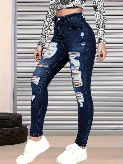High-waisted blue denim ripped jeans, fitted leg with large distressed knee rips