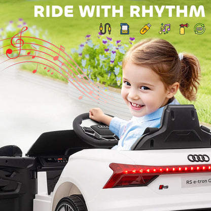 White kids ride-on car with red tail lights and smiling child seated at the wheel
