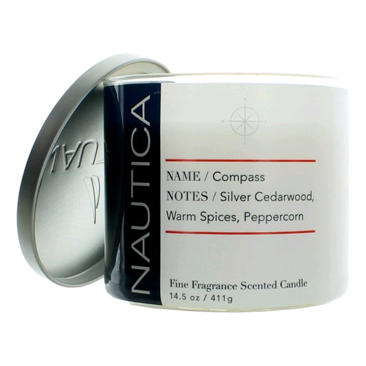 Compass scented candle in clear glass jar with white label and silver lid