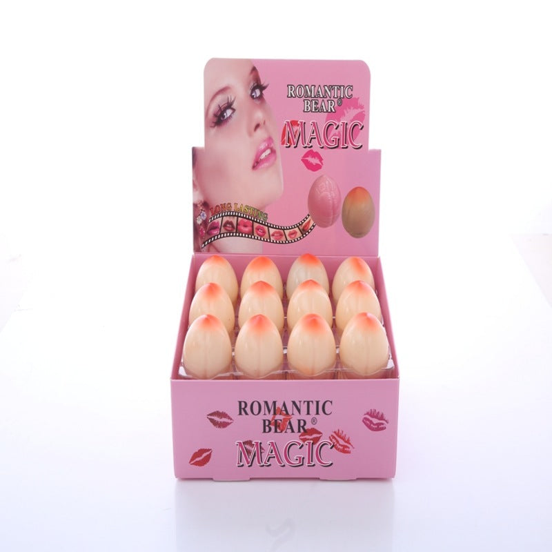 Display box of 'Romantic Bear Magic' products with pink packaging and visible product inside.