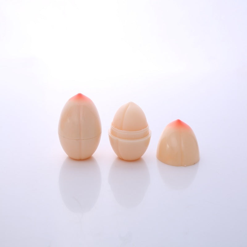 Three beige cosmetic sponges with red tips on a white background