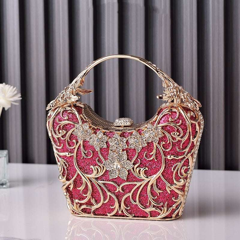 Women’s hollow out shiny clutch with ornate filigree, rhinestone flower, pink and gold