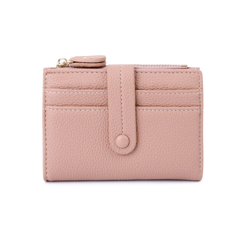 Blush pink short wallet with card slots, snap button tab, and coin zipper pocket