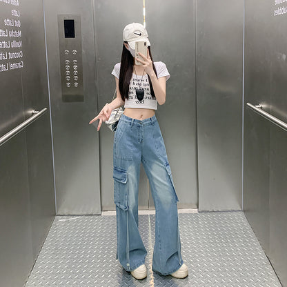Light blue wide-leg cargo pants with side flap pockets and belt loops, floor length