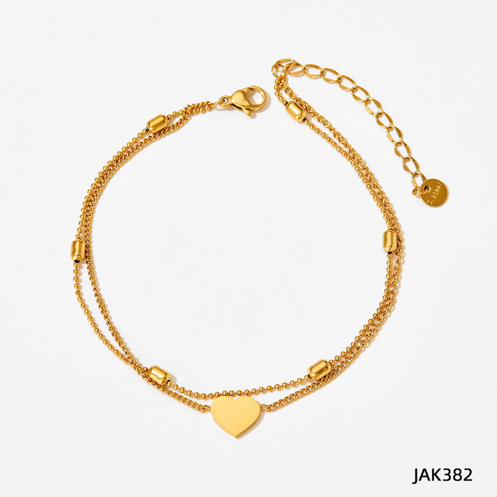 Gold heart charm anklet with linked chain and small round clasp