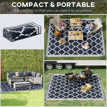 Reversible outdoor rug with black-and-cream quatrefoil pattern on a grass yard