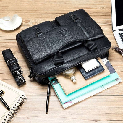Leather business briefcase with front flap, buckle strap, and top carry handle