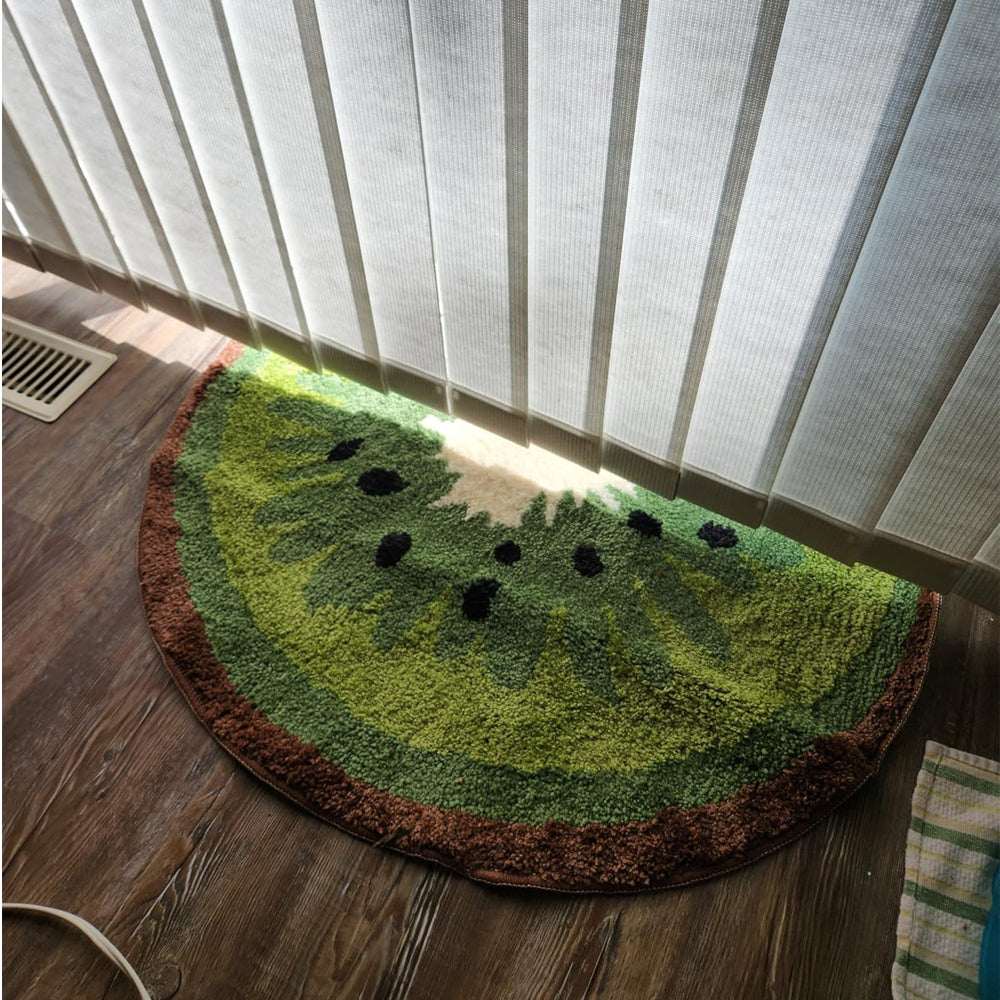 Kiwi fruit bath mat rug, green semicircle with white center, black seed dots, brown edge