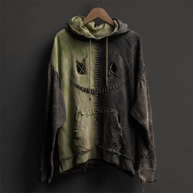 Distressed hoodie with a unique design on a dark background