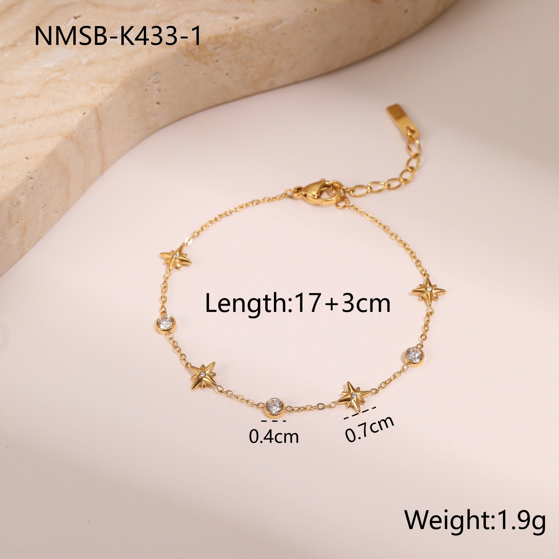 Gold-tone zircon star charm bracelet with extender and small sparkle stones
