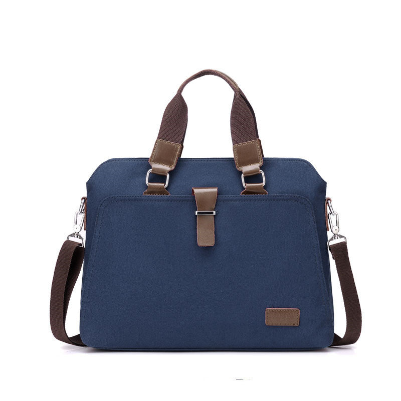 Blue canvas briefcase with top handles, front buckle strap, and side zipper pocket