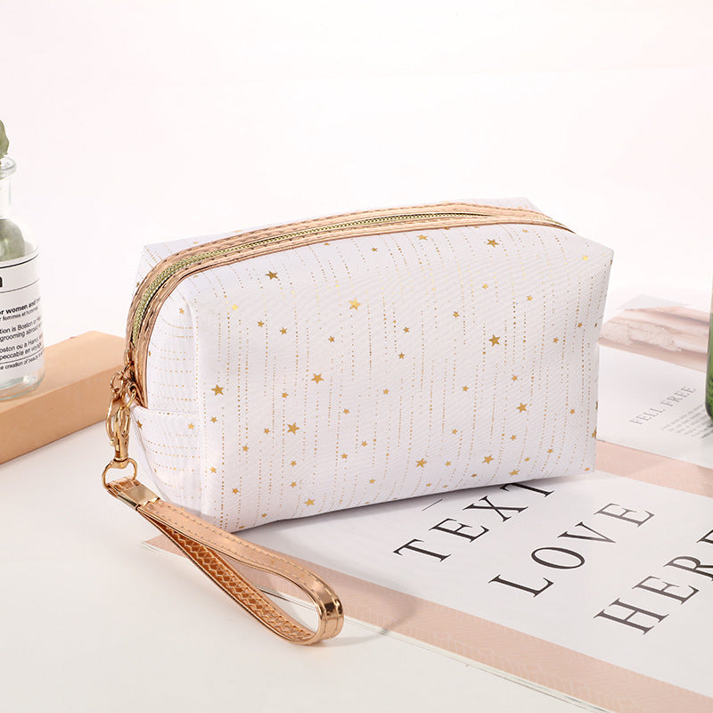 White octagonal star cosmetic bag with gold zipper and wrist strap