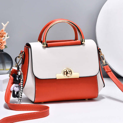 Lightweight crossbody bag with white and red colorblock, top handle, flap, gold clasp